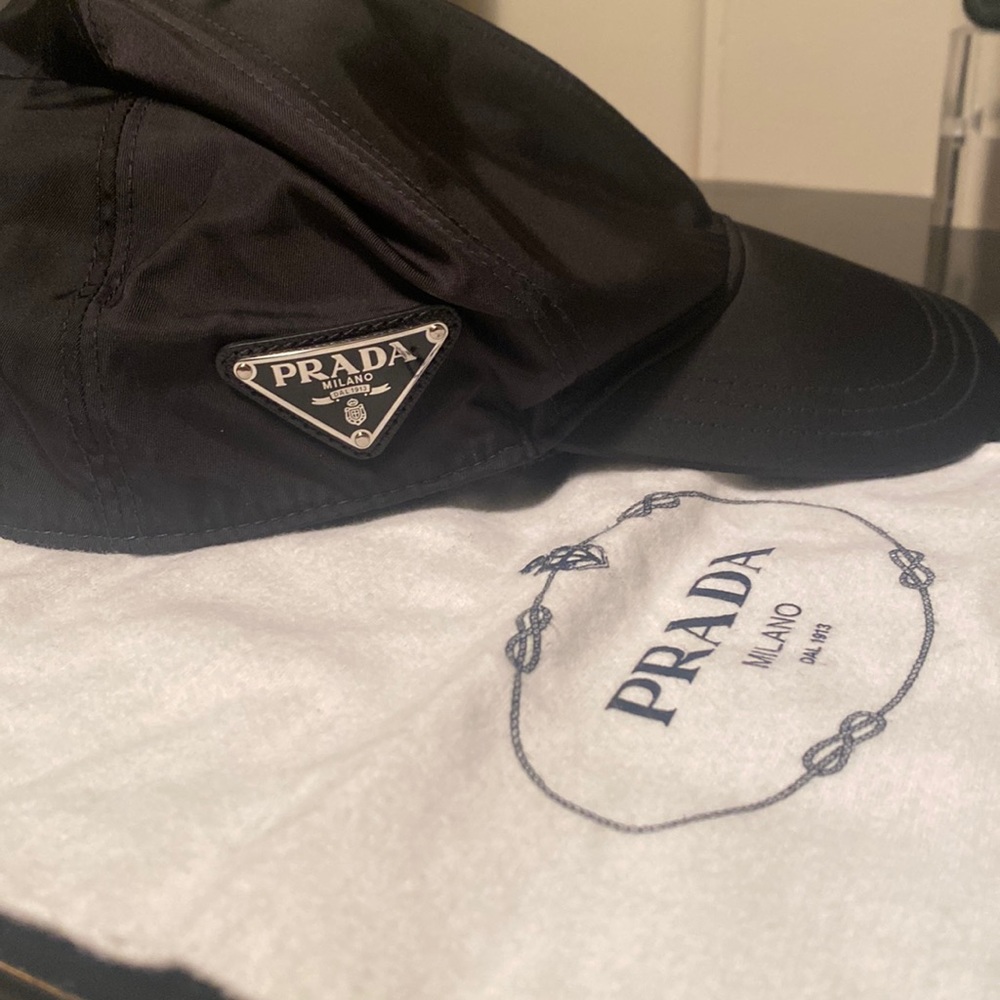 Prada Re-Nylon size medium unisex baseball hat with iconic enamel triangle logo.
